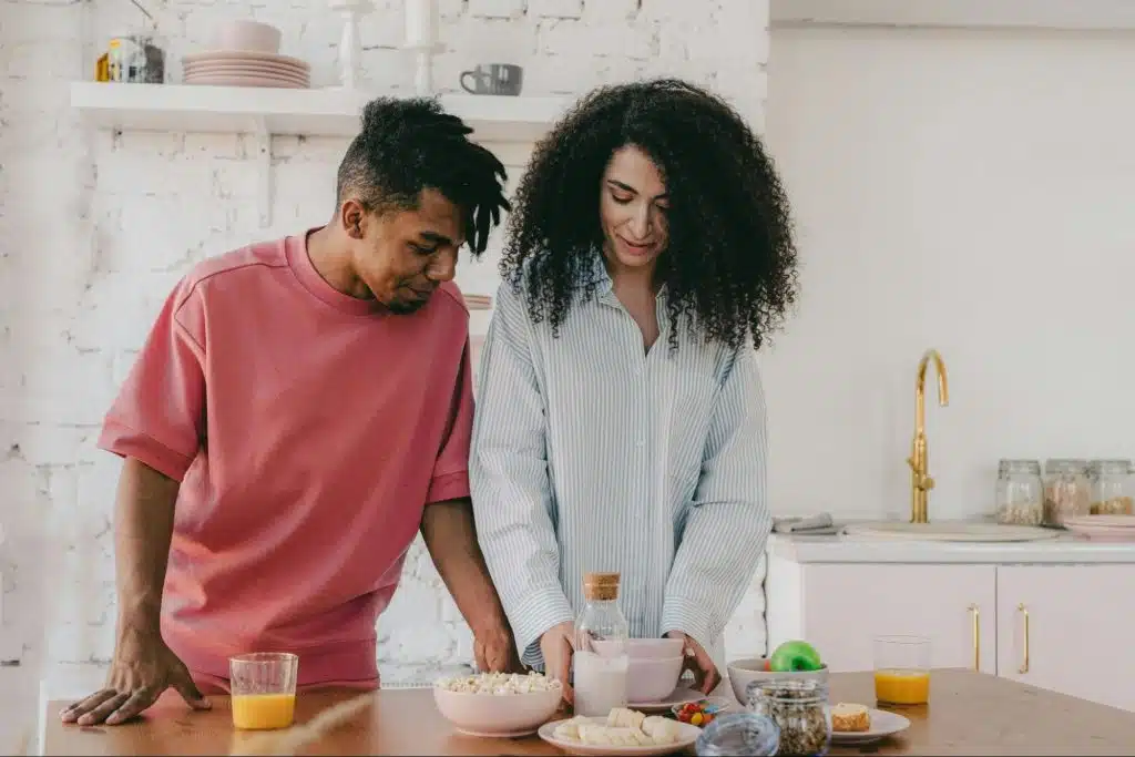 A man and woman at the kitchen