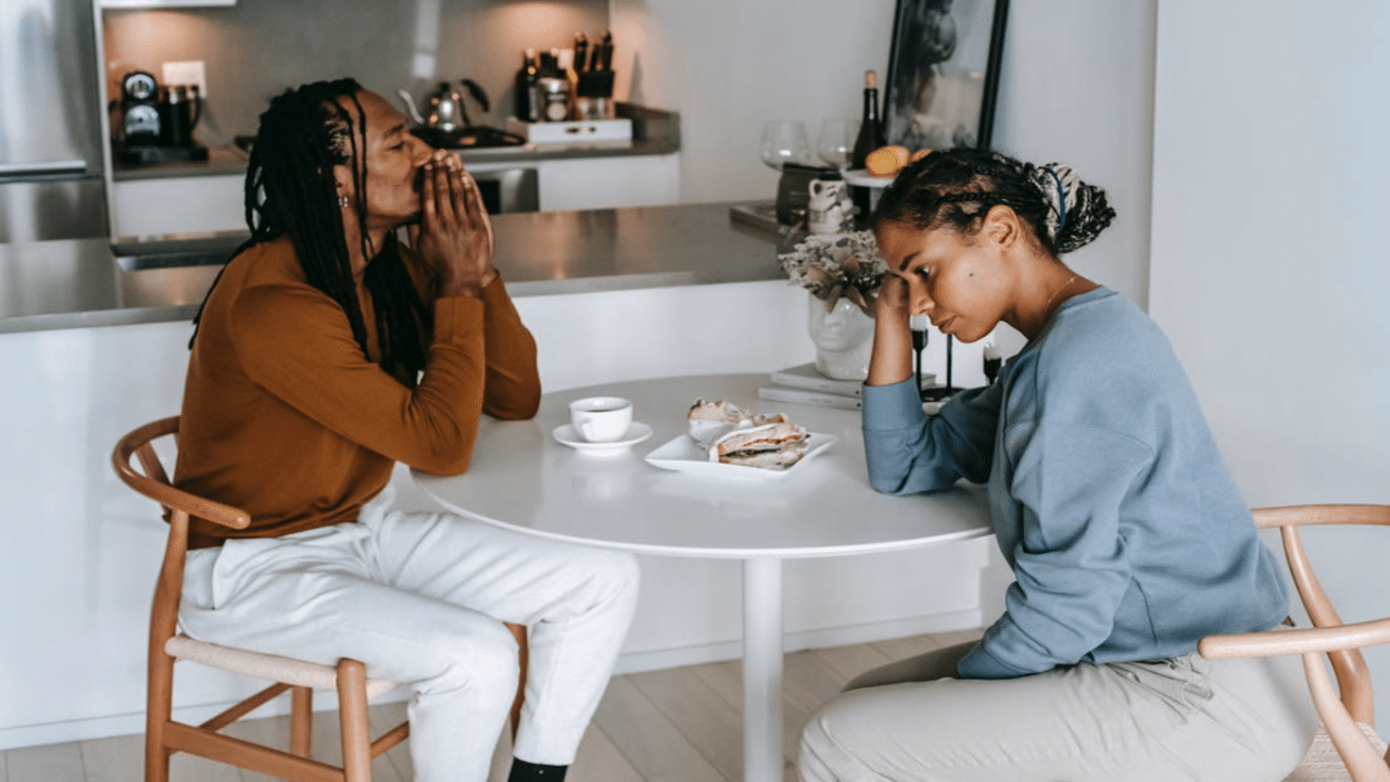 A couple arguing in the kitchen