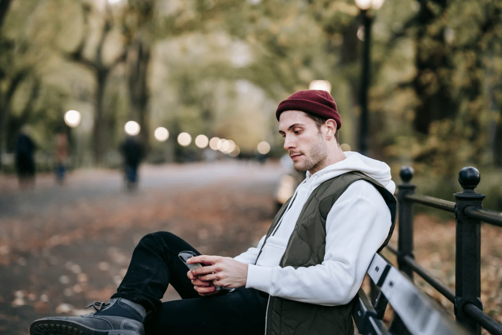 Focused young man with smartphone