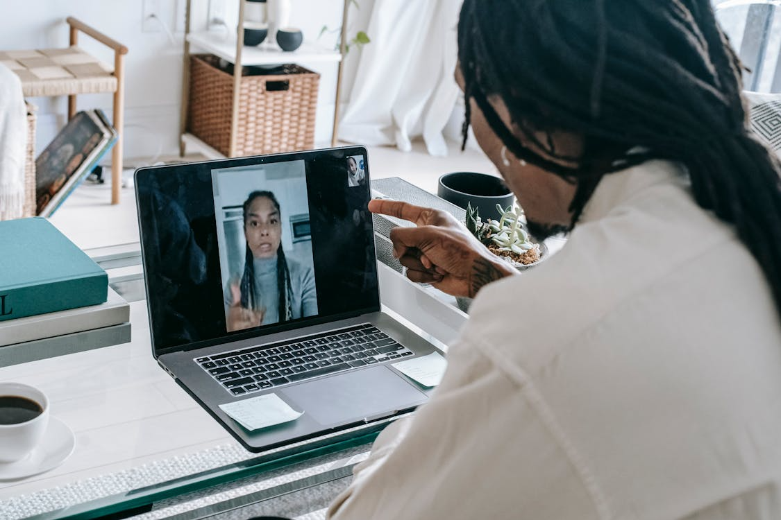 Stressed black couple having video call via laptop