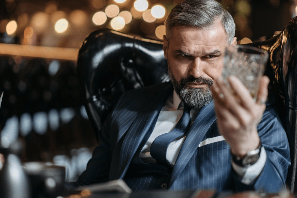 A man holding a glass