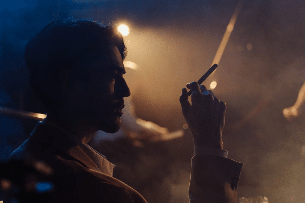 A man holding a cigarette