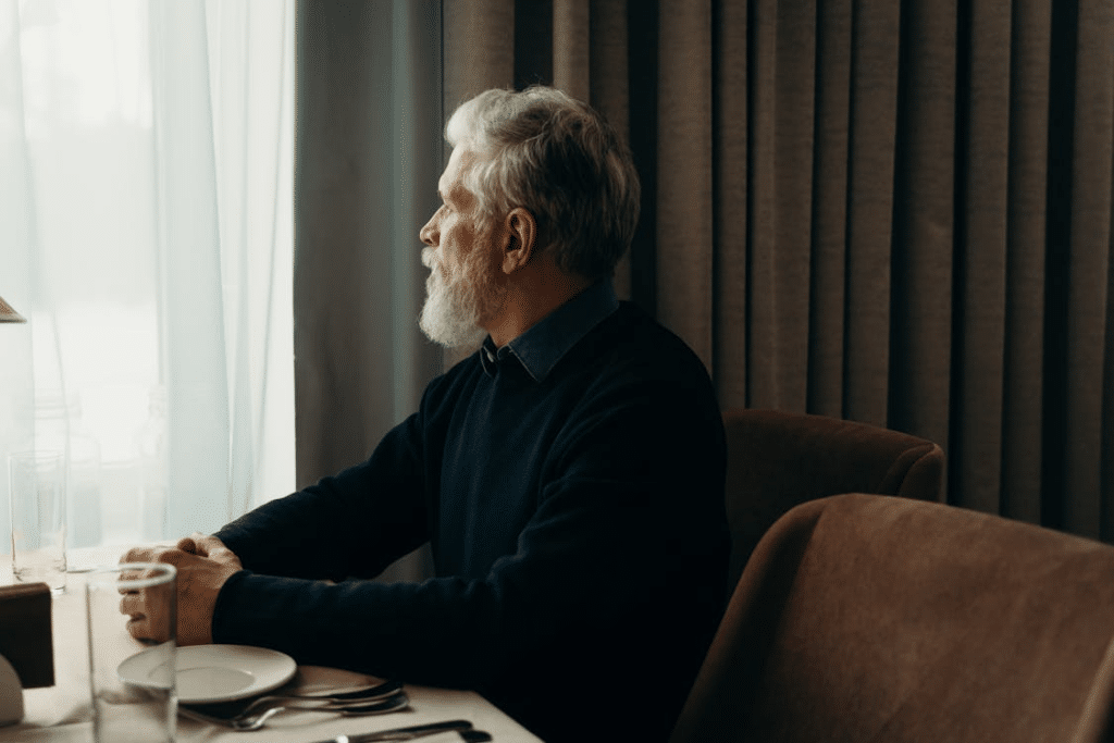 An older man sitting alone