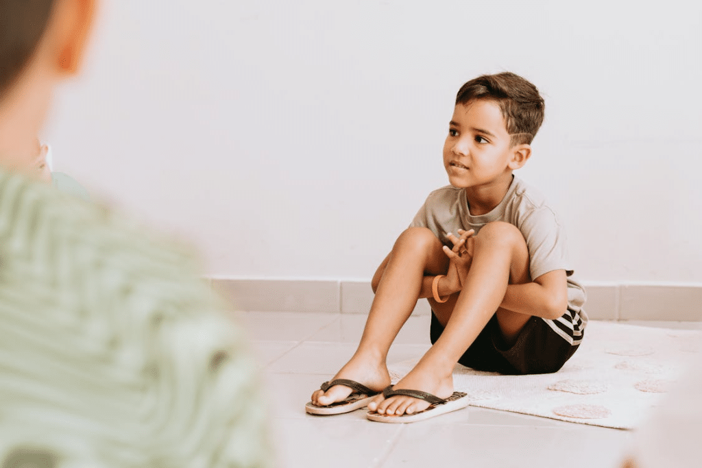 A Boy Sitting on the Floor