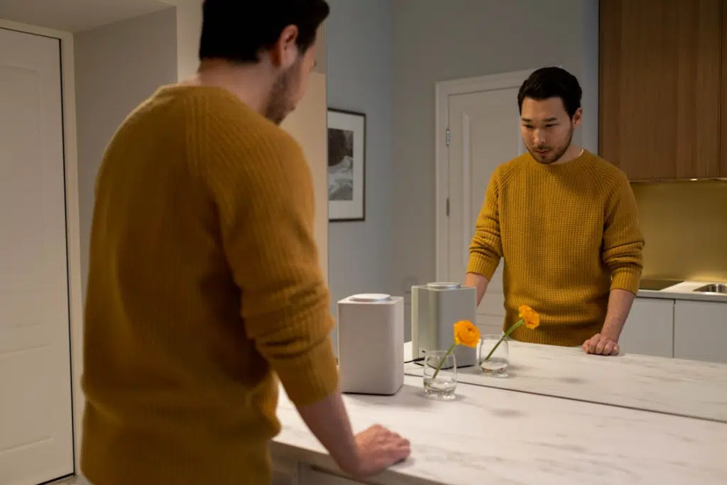 A man standing in front of a mirror