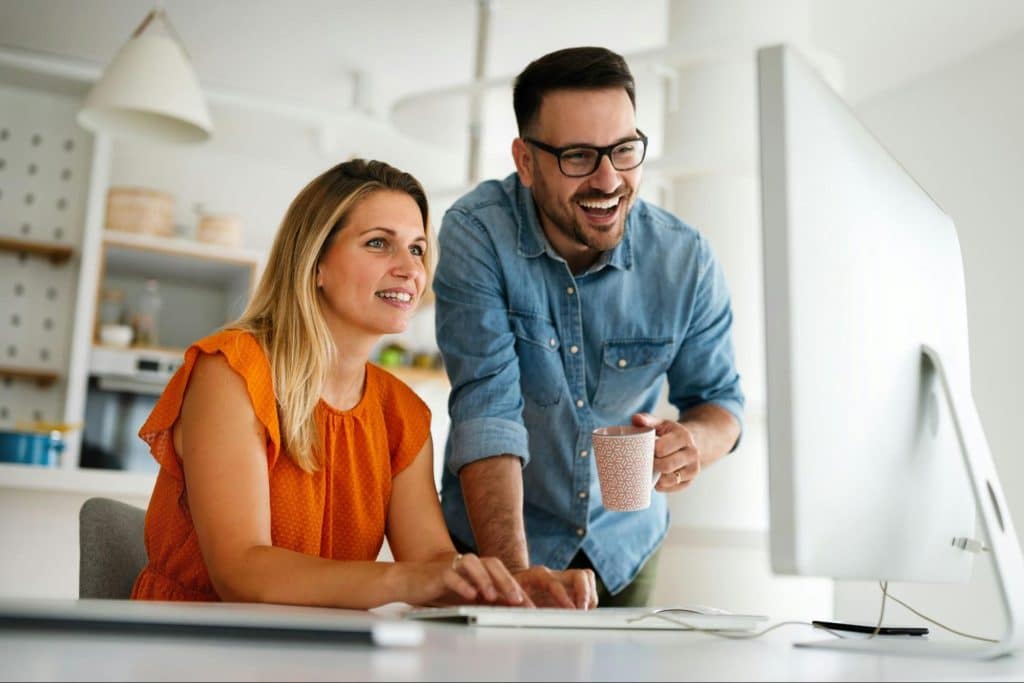 A man showing something to a woman