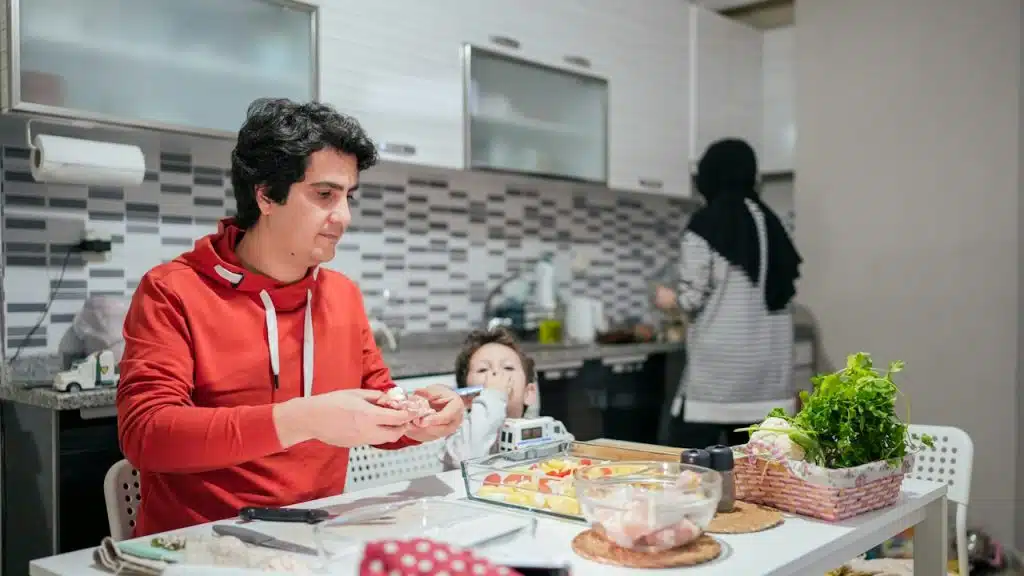 A couple working in the kitchen.