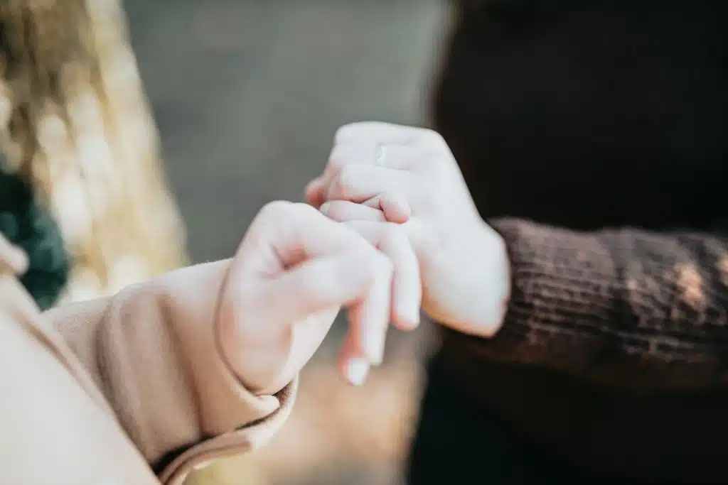 A couple doing the pinky swear 