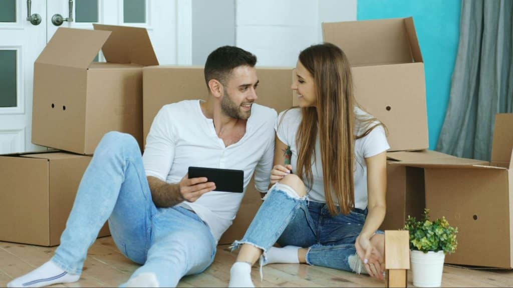 A man and woman sitting at the floor