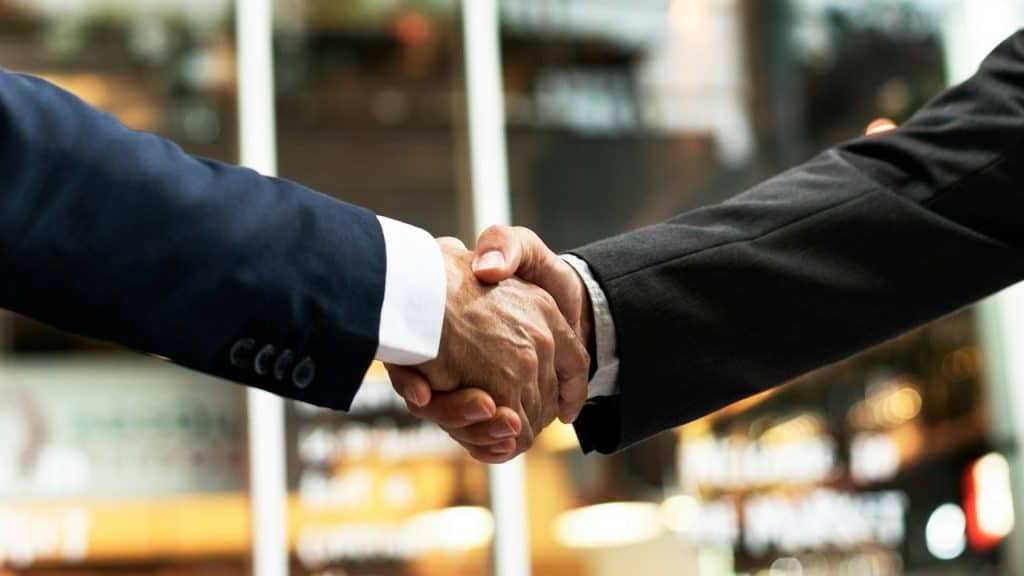 Two men shaking hands.
