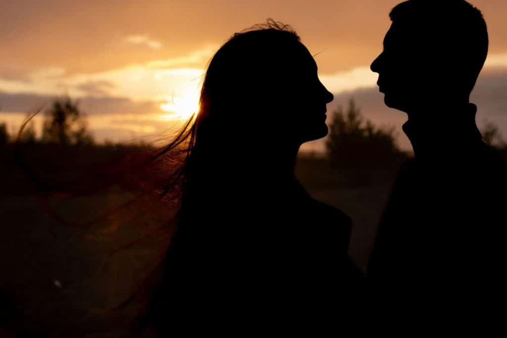 A man and woman at the sunset 