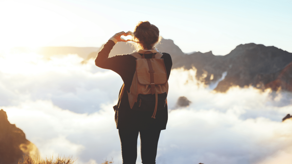 A woman on top of a mountain