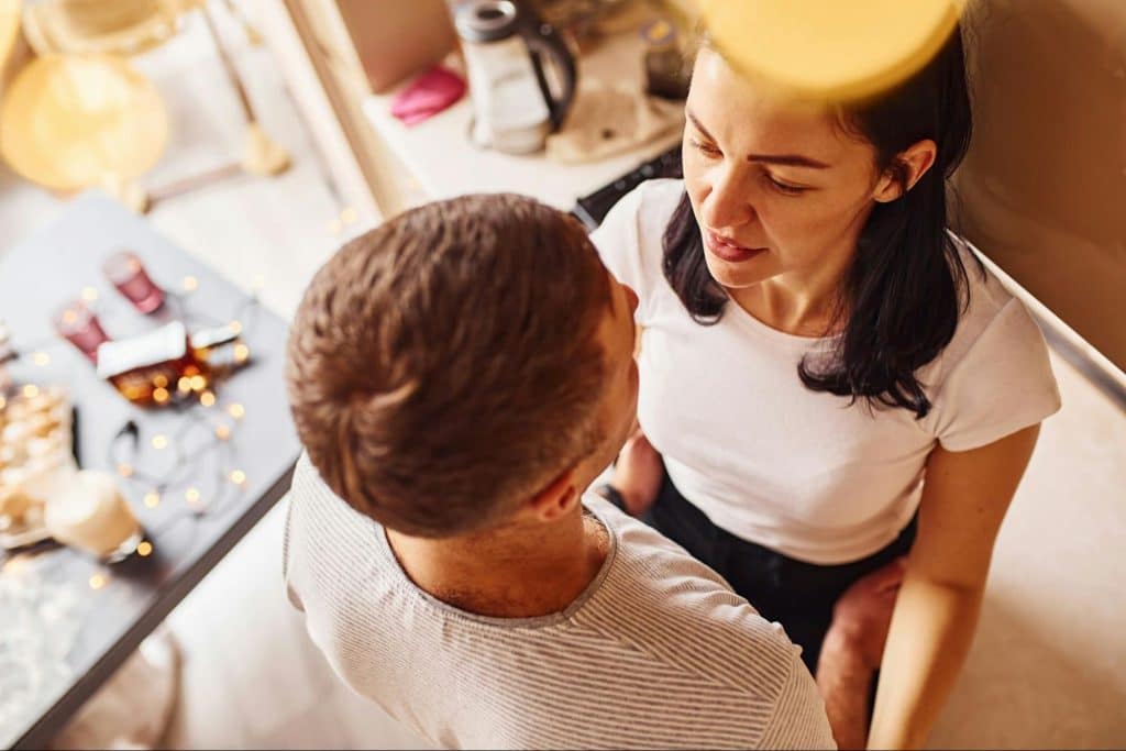 A man and woman facing each other