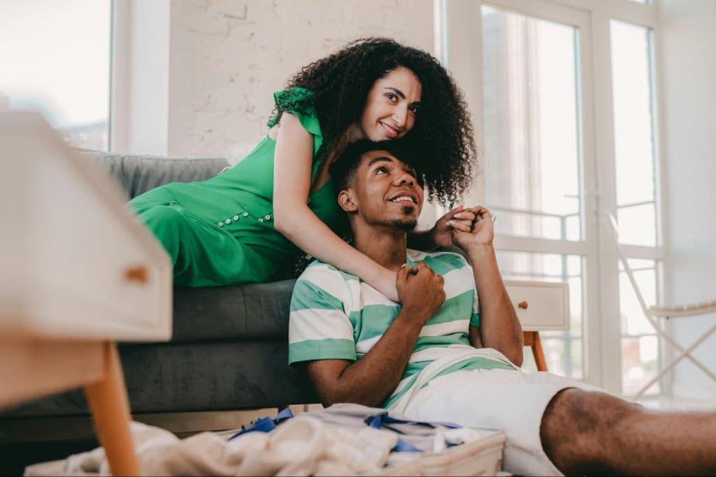 A woman hugging a man