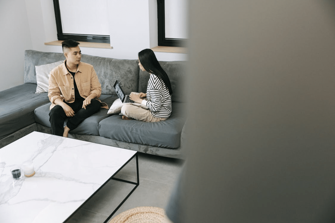 Man and woman sitting on a sofa