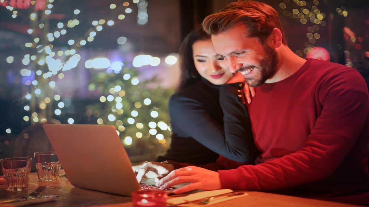 A couple using a laptop together