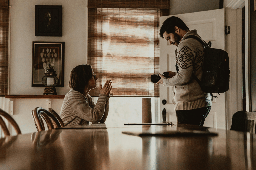 Young couple with photo camera in modern dining room
