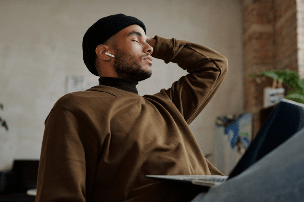 Man in BrowMan in Black Beanie and Brown Sweater