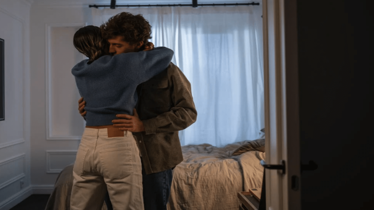 A couple hugging in the bedroom