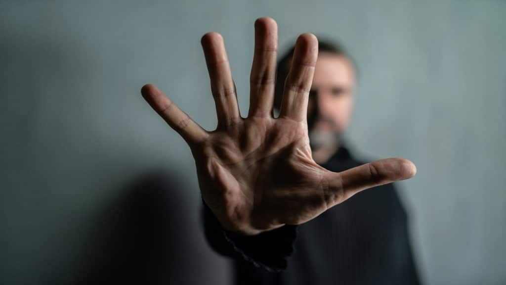 A man saying no with his hand