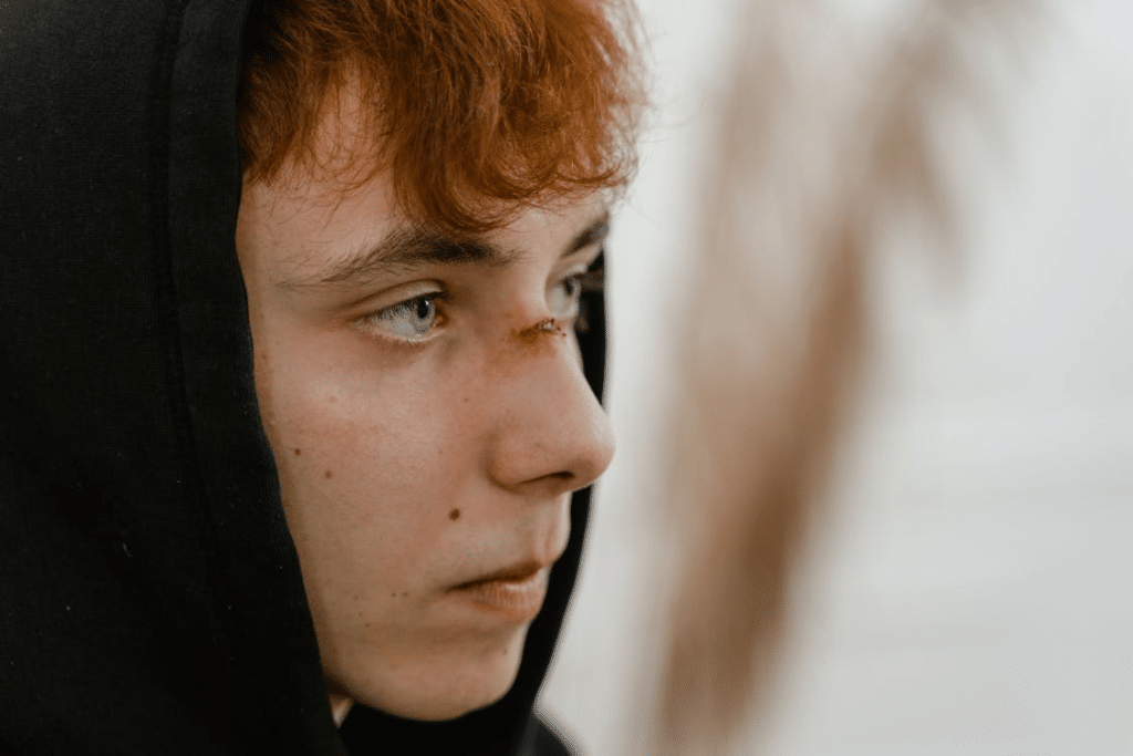 Close-Up Shot of a Man in Black Hoodie