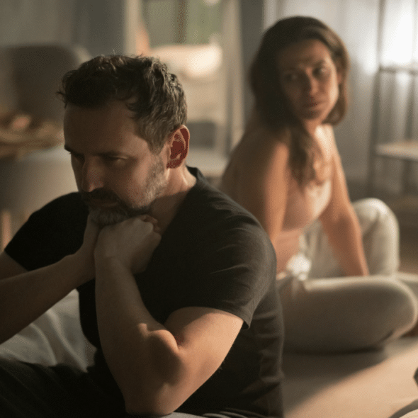 A woman looking at her upset husband