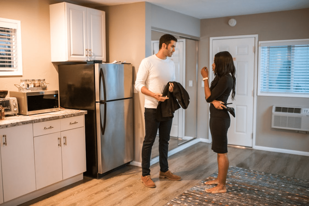 A couple talking in the kitchen
