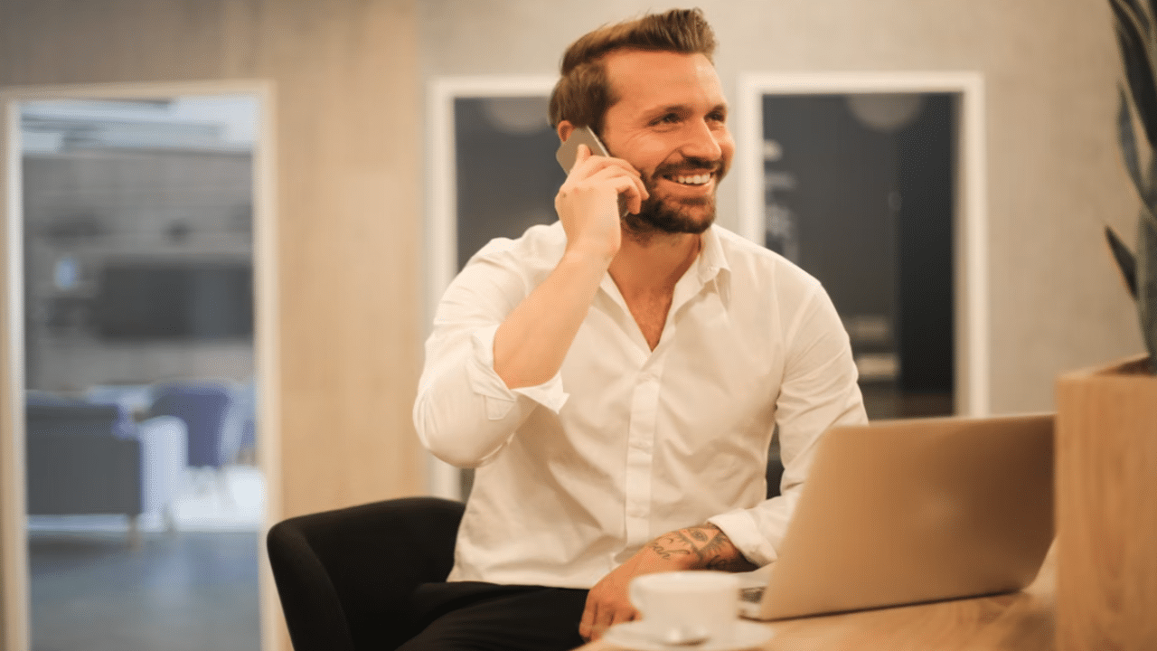 A man smiling at work
