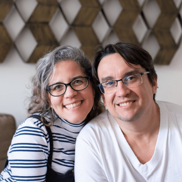 A man and woman smiling
