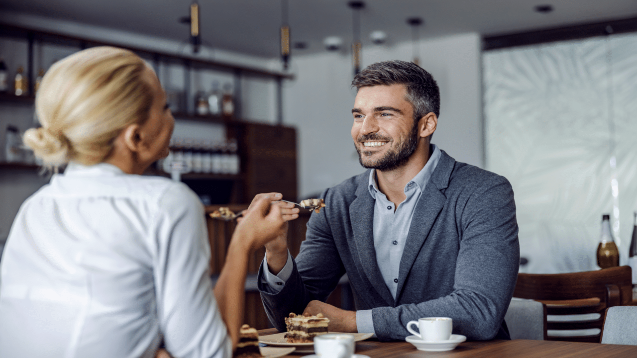 A couple having cake at a restaurant