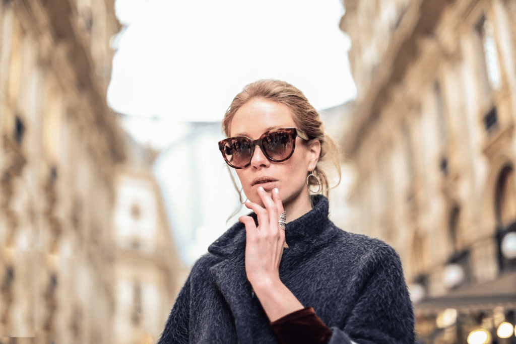 A woman wearing a black coat