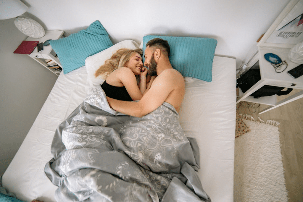 A happy couple in bed