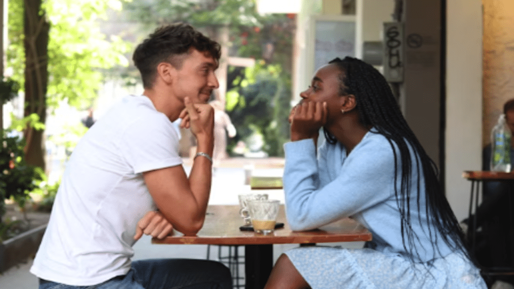 A couple looking at each other during their date