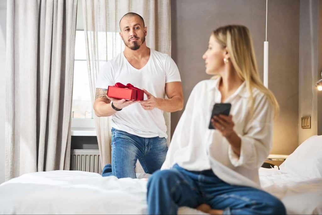 A man giving a woman a gift