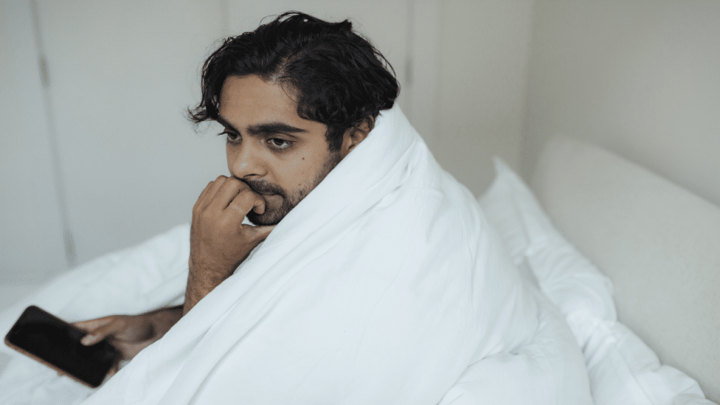 A man thinking while texting