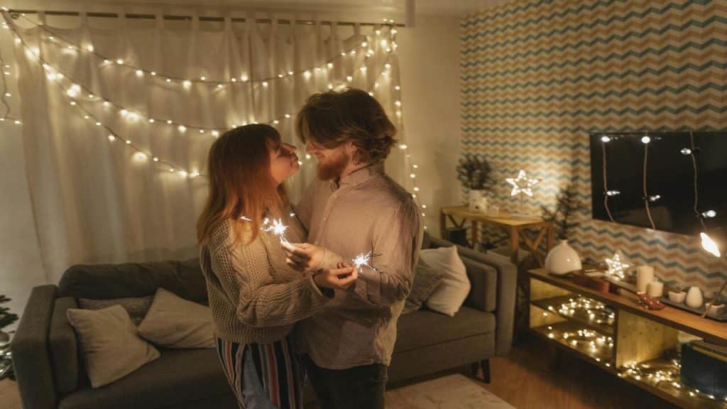 A couple slow dancing in the living room