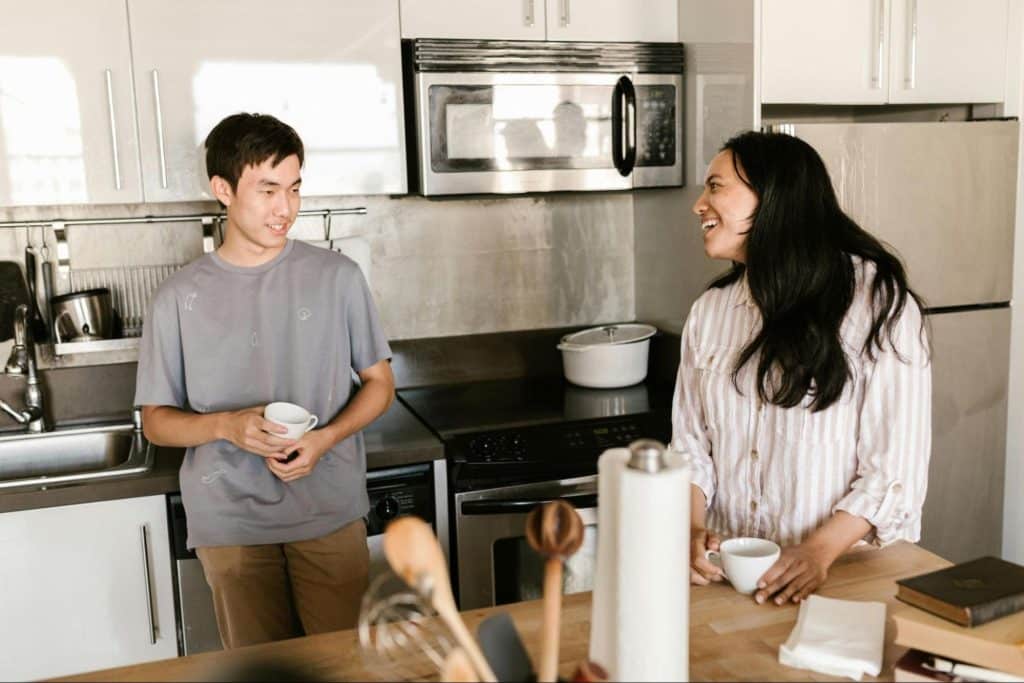 A man and woman at the kitchen