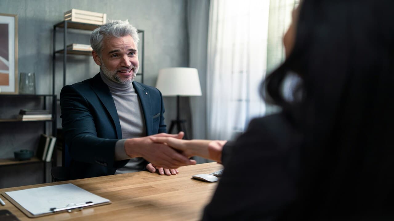 A man and a woman shaking hands