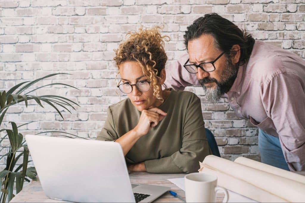 A man and woman having a conversation about work