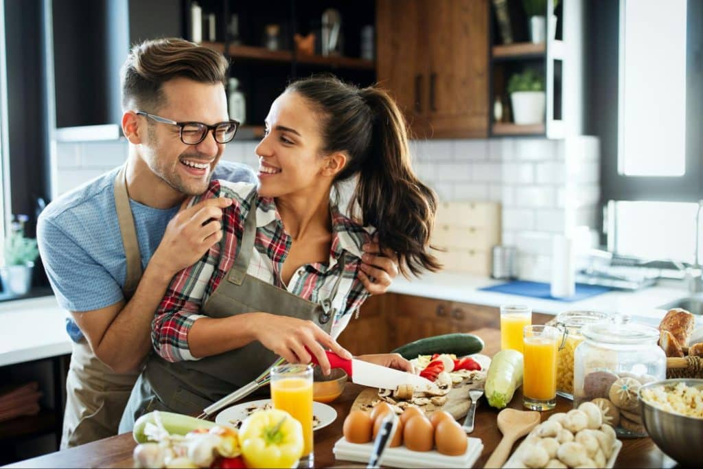 A man and woman at the kitchen