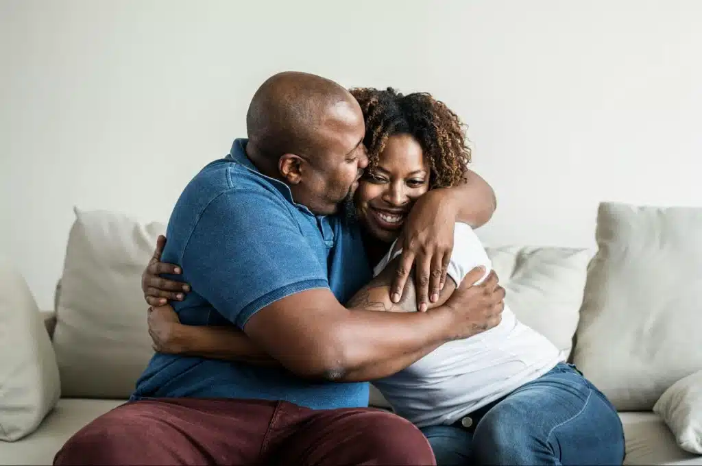 A man and woman hugging