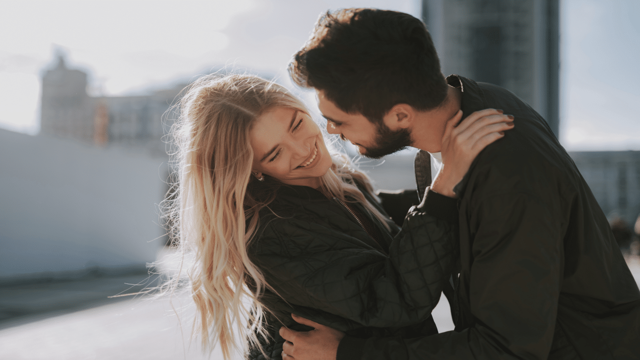 A man trying to kiss his wife