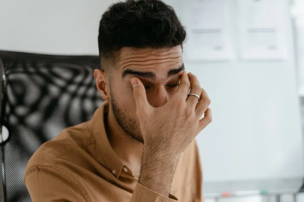 A man in brown polo