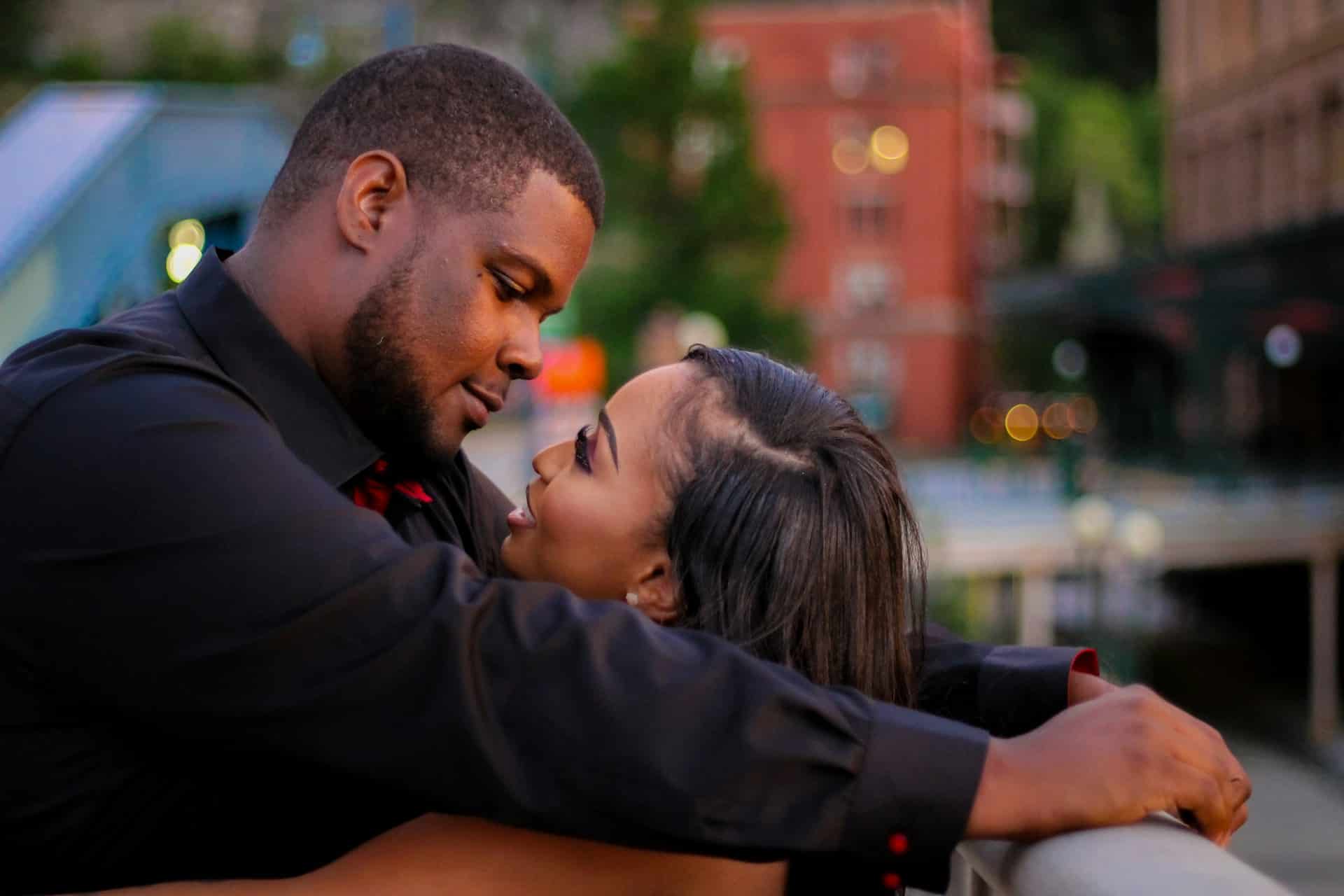 A couple hugging and looking at each other.