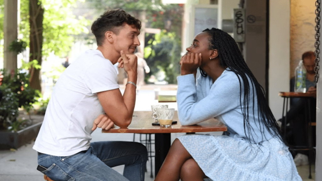 A couple looking at each other during their date