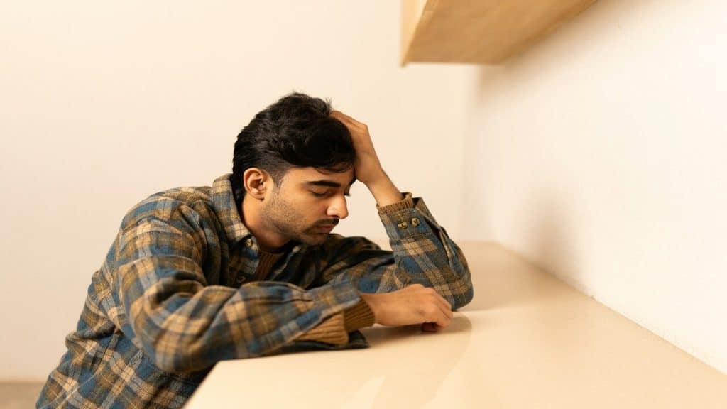 A man looking sad at home 