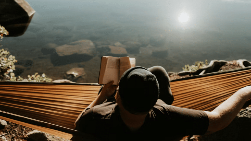 A man relaxing on a hammock 