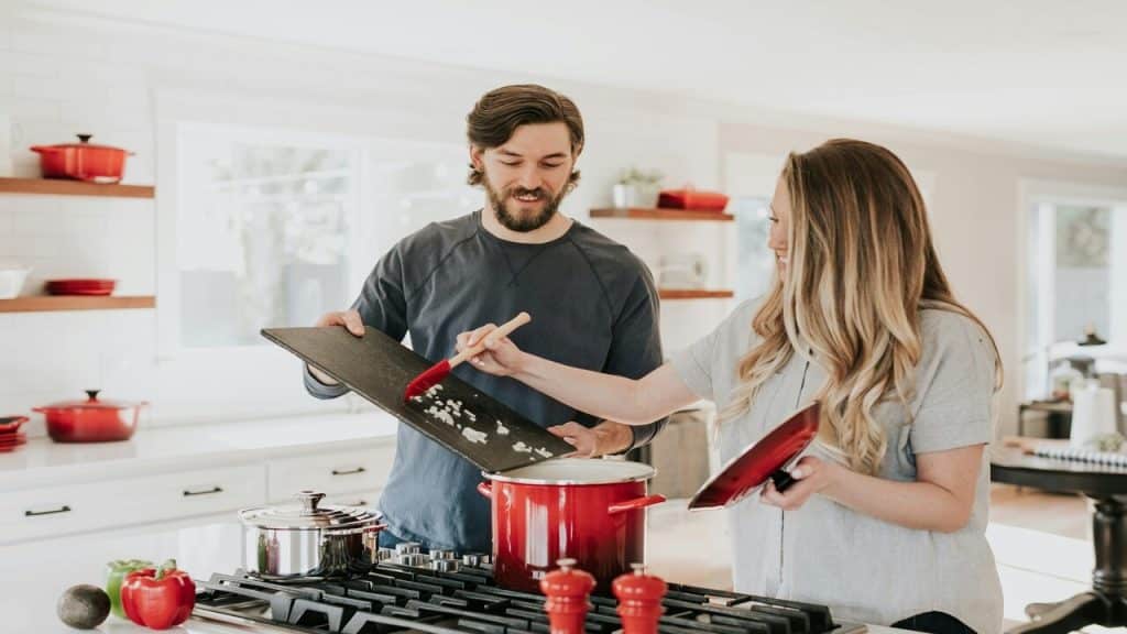 A couple cooking together 