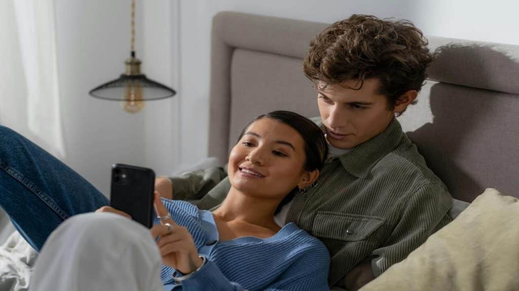 A couple looking at a phone