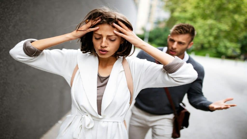 A couple arguing outdoors